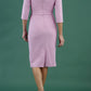 model is wearing diva catwalk jacky dress with rounded neckline 3/4 sleeve and bow detail on the waist in dawn pink back