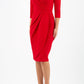 model wearing diva pencil dress tulip design with overlapping pencil skirt with 3 4 sleeves in colour scarlet red front 