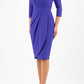 model wearing diva pencil dress tulip design with overlapping pencil skirt with 3 4 sleeves in colour spectrum indigo front 