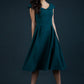 model is wearing divacatwalk Chesterton Sleeveless a-line swing dress in forest green with oversized collar