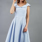 model is wearing divacatwalk Chesterton Sleeveless a-line swing dress in celestial blue with oversized collar front