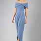 odel wearing diva catwalk vegas calf length stone blue midaxi dress with wide bardot neckline and open shoulders with a large opening at the front of the skirt with pleating coming down long skirt front