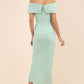 brunette model wearing diva catwalk vegas calf length pale green midaxi dress with wide bardot neckline and open shoulders with a large opening at the front of the skirt with pleating coming down long skirt back