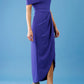 brunette model is wearing the diva catwalk vegas midaxi calf length dress off shoulder in spectrum indigo side