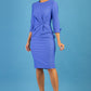 blonde model is wearing diva catwalk logan round neck sleeved pencil dress with side arrow pleating detail in thistle blue front