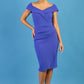 brunette model wearing diva catwalk evening pencil skirt dress sleeveless with lowered neckline and pleating on side in indigo blue colour front