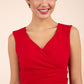 brunette model wearing diva catwalk pencil-skirt red dress with v-neckline and pleating across the tummy without sleeves front
