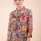 Model is wearing the Diva Branscombe 3/4 Sleeve blouse in floral print taupe front image 