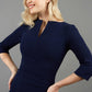 model wearing Diva Catwalk pencil three quarter sleeve dress with a split neckline and pleating across the tummy in navy front