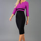 A model is wearing a three quarter sleeve colour block pencil dress by Diva Catwalk in Black and Dawn Purple colour