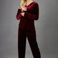 blonde model wearing diva catwalk dahlia asymmetric velvet top with sleeves in burgundy front