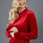 blonde model is wearing diva catwalk allium velvet sleeved high neck top in colour red front
