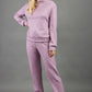 blonde model wearing diva catwalk hudson top with long sleeves and boat neckline in very soft cosy cashmere fabric in pink colour front with aria joggers marching the top front