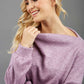 blonde model wearing diva catwalk hudson top with long sleeves and boat neckline in very soft cosy cashmere fabric in pink colour front