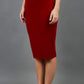 model is wearing diva catwalk triste velvet pencil skirt in red front