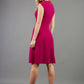 blonde model is wearing diva catwalk sleeveless swing skirt dress with asymmetric neckline in pink back