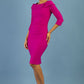 brunette model is wearing diva catwalk pencil dress with collar and a button detail on a side with 3/4 sleeve in magenta haze front