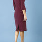 model is wearing diva catwalk neptune pencil off-shoulder dress with 3/4 sleeve in burgundy sparkle front