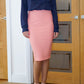 blonde model is wearing diva catwalk pencil skirt in peach paired with hambledon long sleeved top front