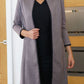Model wearing the Diva Alverstone Coat in Mist Pink and black front image    