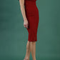brunette model wearing diva catwalk amorette pencil skirt dress with a cold shoulder detaul and pleating across the bust and slit on a side of skirt in rosewood red colour front