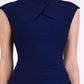 brunette model wearing diva catwalk beyonce pencil fitted dress with high neckline without sleeves with a wide band and pleating across the tummy area with a crossed detail neckline in navy blue  front