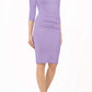 Model wearing the Diva Daphne ¾ Sleeved dress with pleat detail across the hips and ¾ sleeve length in lilac wisteria front image