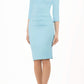 Model wearing the Diva Daphne ¾ Sleeved dress with pleat detail across the hips and ¾ sleeve length in sky blue front image