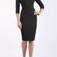brunette model wearing diva catwalk best selling lydia pencil sleeved dress with slit at the neckline and pleating across the tummy in colour black front