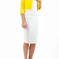 brunette model wearing diva catwalk yellow sleeved bolero over a white pencil dress front