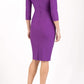 model wearing diva catwalk york pencil-skirt dress with sleeves and rounded folded collar and plearing across the tummy area in royal purple colour back