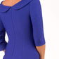 model is wearing diva catwalk seed axford pencil sleeved dress with rounded folded collar in palace blue back close up
