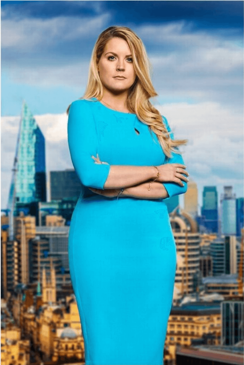 Pamela Laird wearing cobalt blue Diva Catwalk pencil dress. Standing against a background of the city of London 