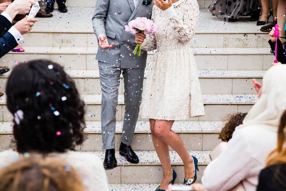 couple after wedding standing on steps 