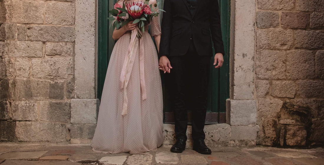 Couple, pink dress, black suit, flowers