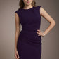 Woman wearing a purple dress against a brown background (Crown Jewel)