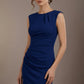 Woman wearing a blue dress against a brown background (Navy Blue)