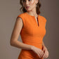 Woman wearing an orange dress against a brown background (Sun Orange)