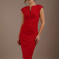 Woman wearing a red dress against a brown background (True Red)
