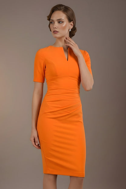Woman wearing an orange dress against a brown background (Sun Orange)