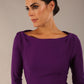 Model wearing the Seed Agatha in pencil dress design in royal purple back image close up