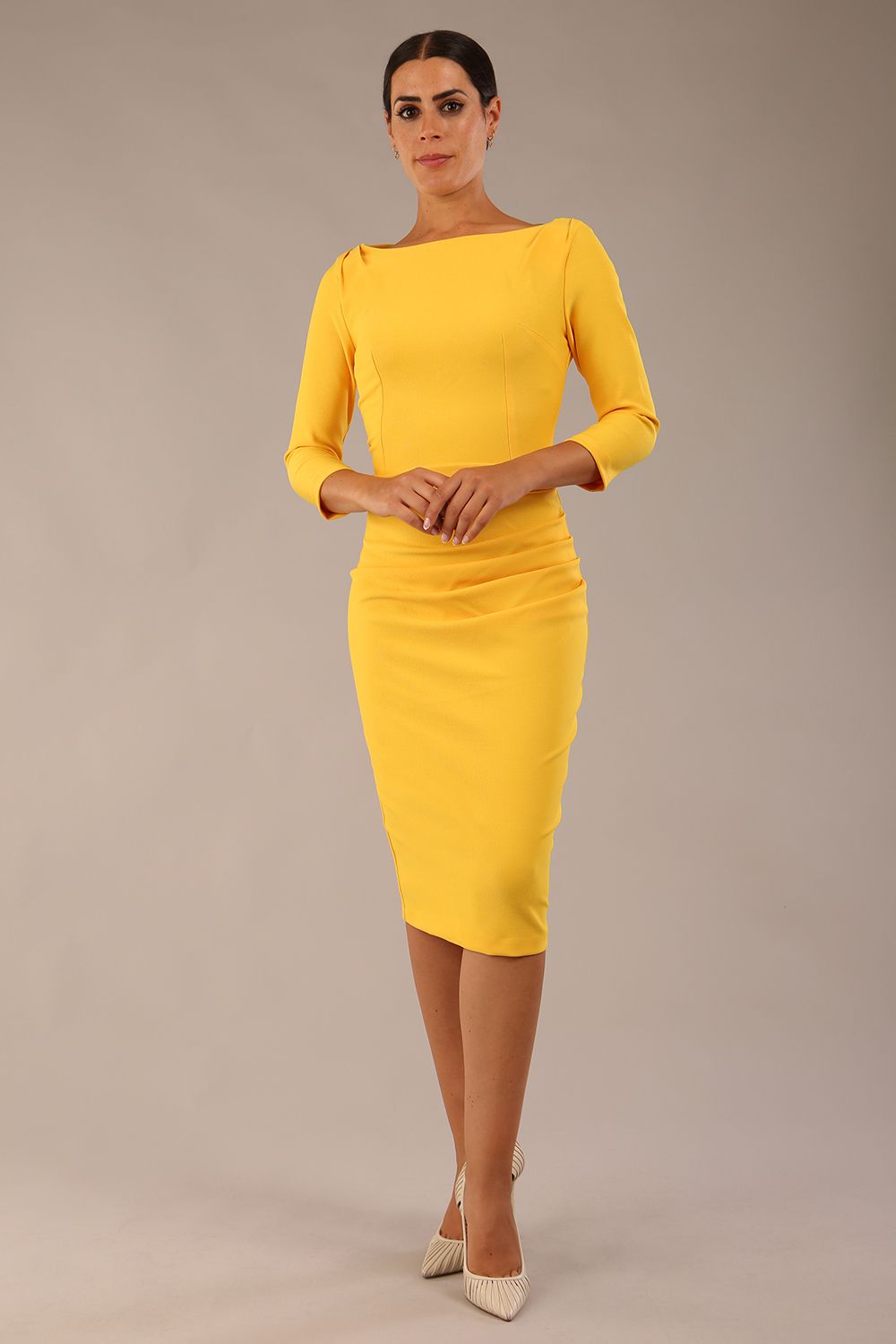 Model wearing the Seed Agatha in pencil dress design in daffodil yellow front image