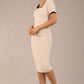 model wearing seed albany contrasted pencil-skirt dress with short sleeves and pleating across the tummy with low square neckline and contrasted detail finishing in sandy cream front