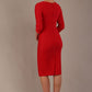 Woman wearing a diva catwalk salsa red Seed Greenwich Sleeved Pencil Dress with a plain background back view
