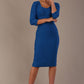 Woman wearing a diva catwalk Seed Greenwich Sleeved Pencil Dress in sapphire blue colour with a plain background