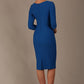 Woman wearing a diva catwalk Seed Greenwich Sleeved Pencil Dress in sapphire blue colour with a plain background back view
