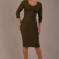 Woman wearing a diva catwalk Seed Greenwich Sleeved Pencil Dress in Olive Green colour with a plain background
