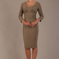 Woman wearing a diva catwalk Seed Greenwich Sleeved Pencil Dress in taupe brown colour with a plain 