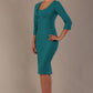 Woman wearing a diva catwalk Seed Greenwich Sleeved Pencil Dress in harbour green colour with a plain background