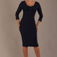 Woman wearing a diva catwalk Seed Greenwich Sleeved Pencil Dress in navy blue colour with a plain background